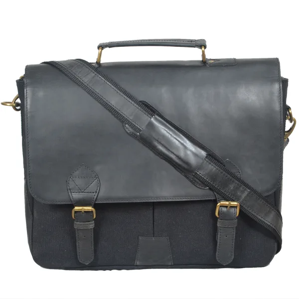 Handcrafted black leather and canvas messenger bag with adjustable strap and brass buckle closures