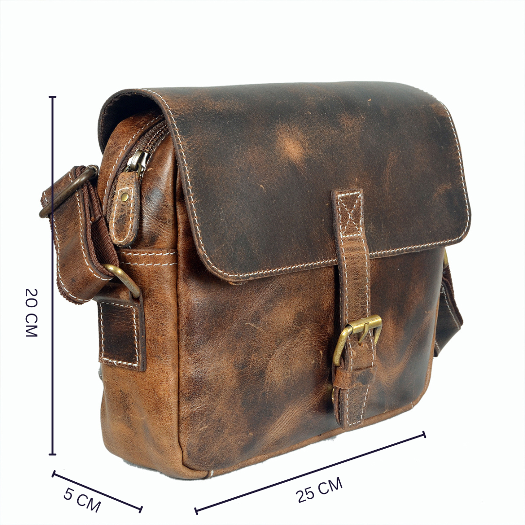 Handcrafted vintage brown leather sling bag with brass buckle and adjustable strap